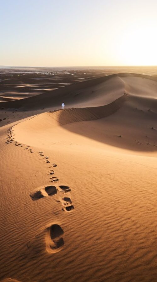 footsteps-left-in-sand-dunes-min